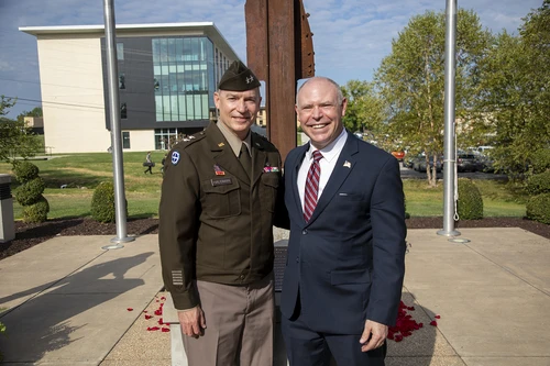 Photo of two men smiling.
